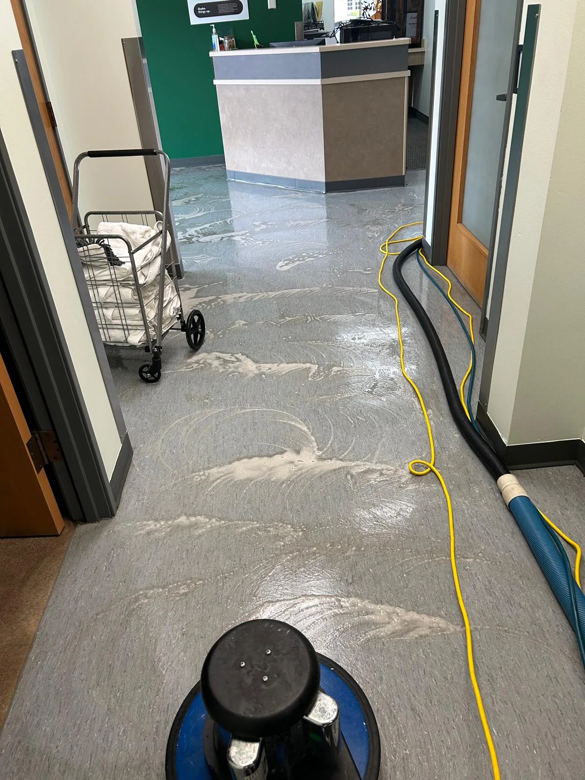 Commercial floor pretreated before rotary cleaning