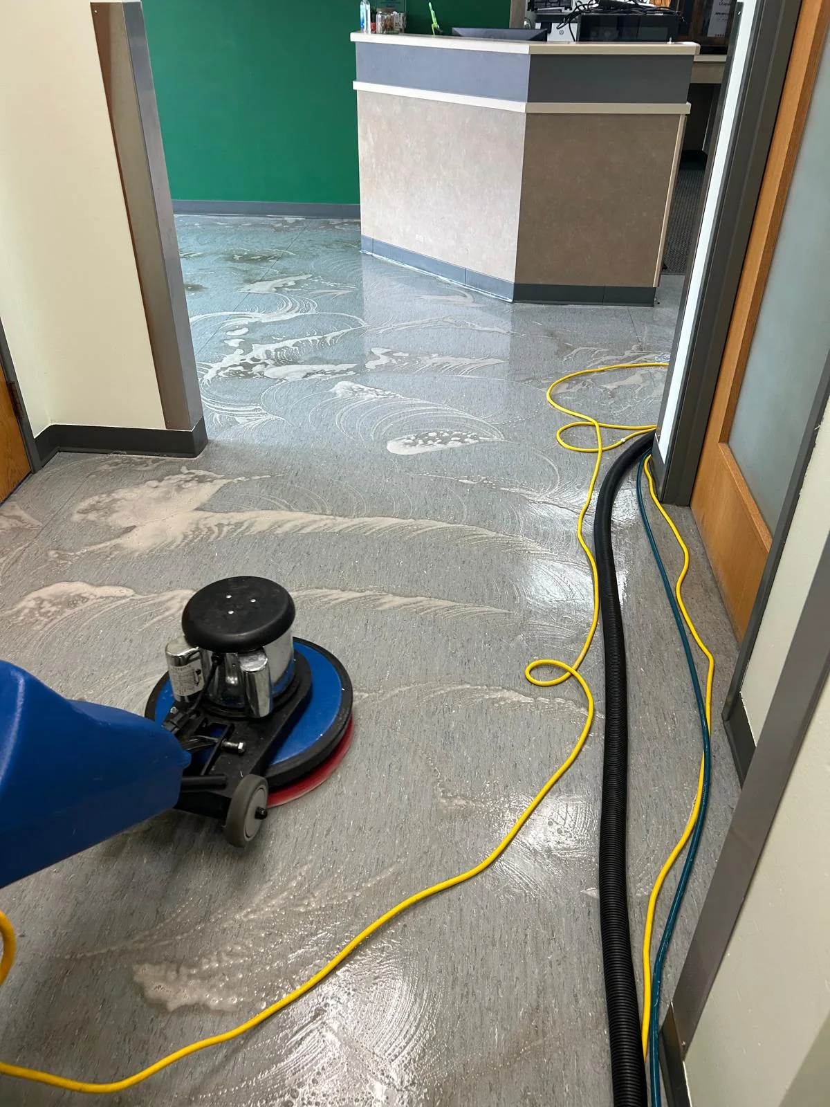 Commercial floor pretreated with cleaning solution before extraction